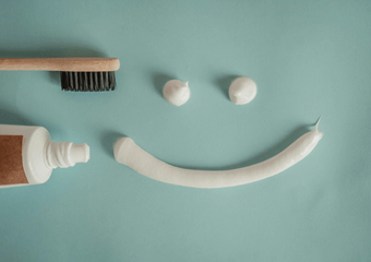 How should we clean our teeth ?